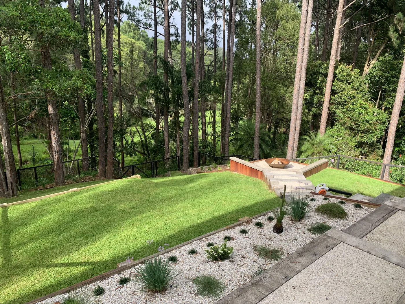 Lush green lawn backing onto natural bushland