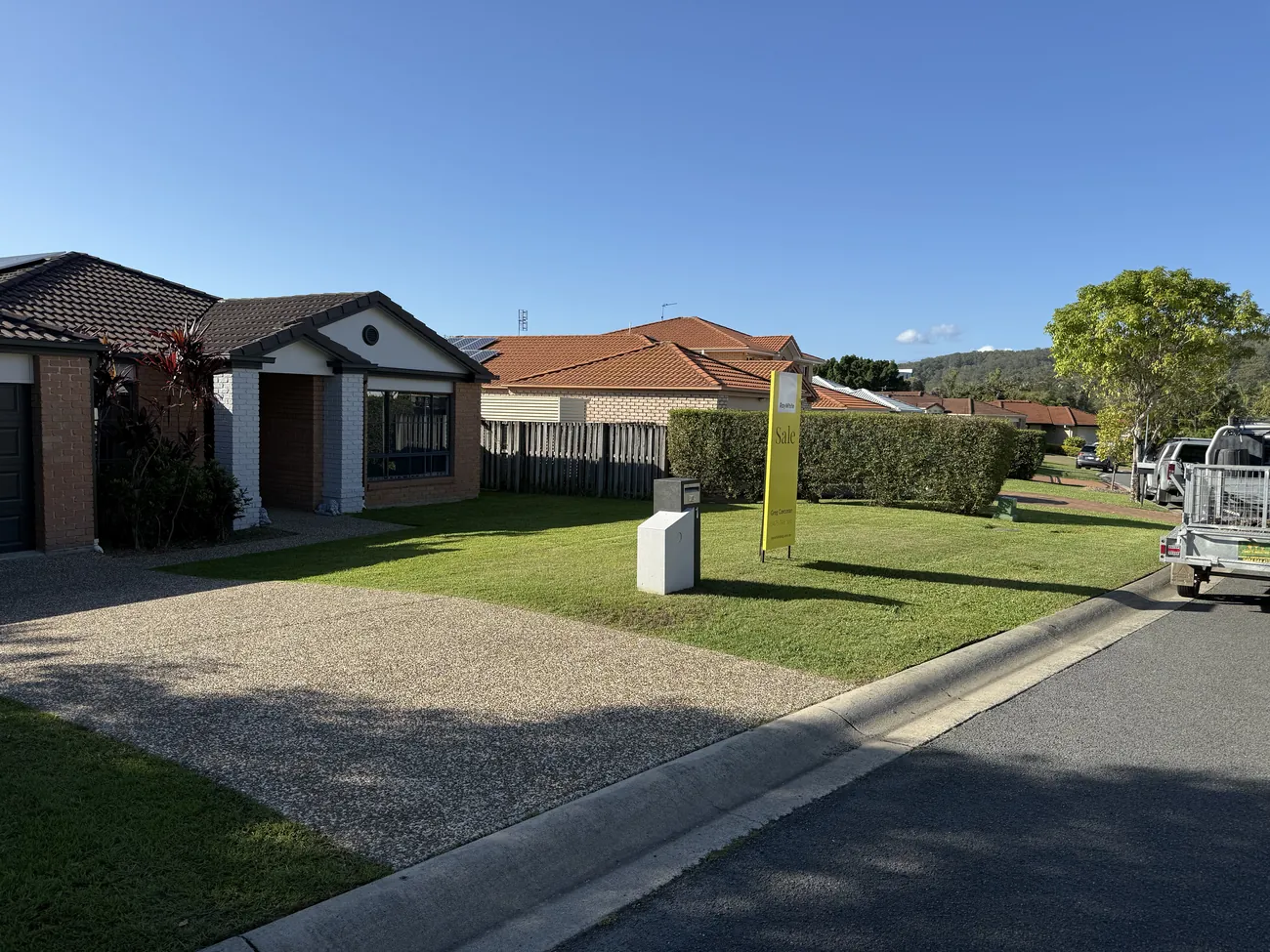 Freshly mowed front lawn with the work ute
