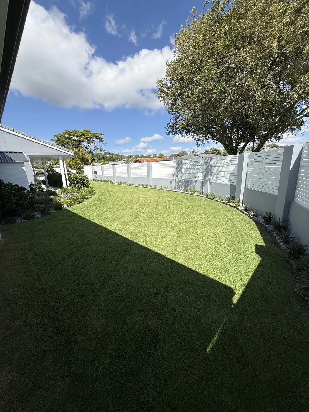 Tidy, manicured lawn after a full yard clean-up
